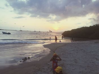 Scenic view of beach against sky during sunset