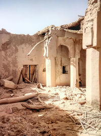 Damaged building against sky