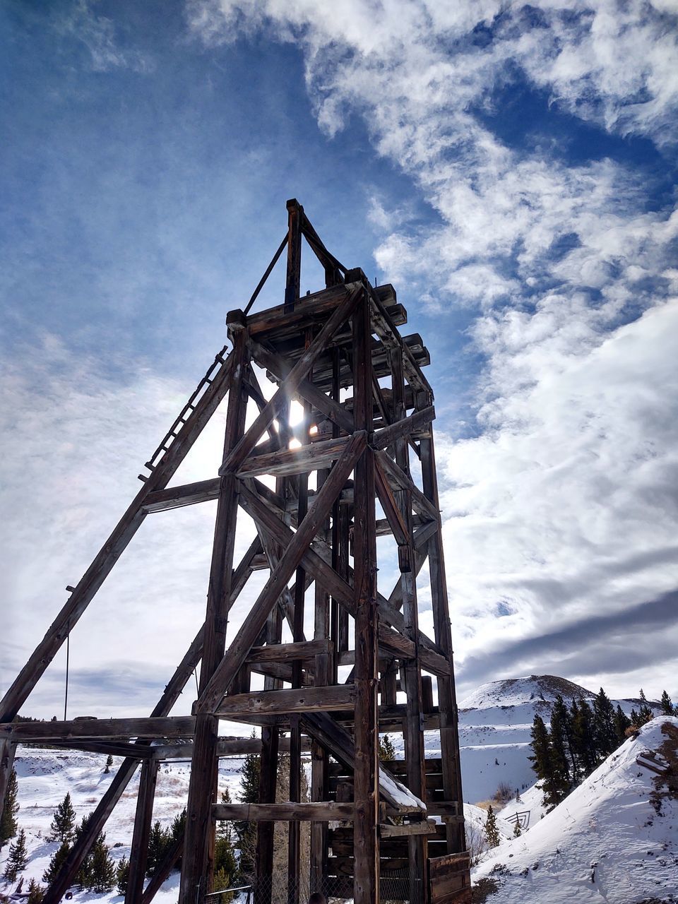 LOW ANGLE VIEW OF METALLIC STRUCTURE AGAINST SKY