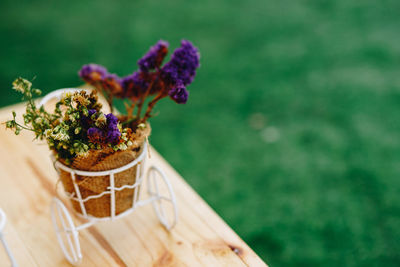 Close-up of purple flower pot on table