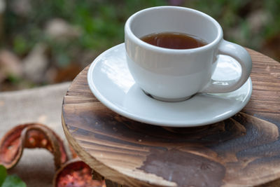 Close-up of coffee cup on table