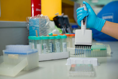 Cropped hand of doctor doing research in laboratory