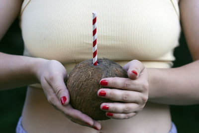 Woman holding coconut