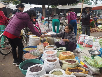 Group of people at market stall