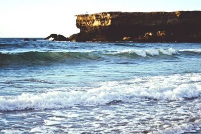 Waves splashing on rocks