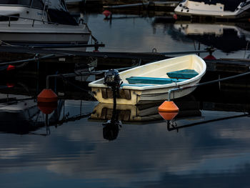 Boats moored at harbor