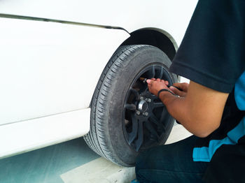 Midsection of man working against sky