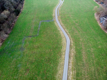 High angle view of road amidst field