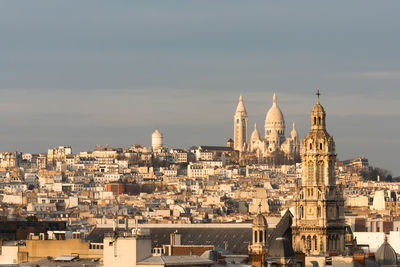 Cityscape against sky during sunset