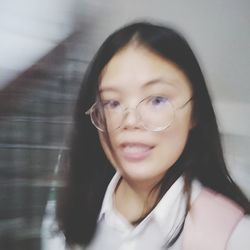 Close-up portrait of a smiling young woman