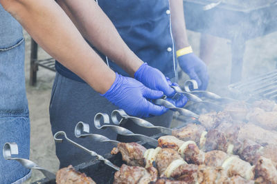 Midsection of man preparing food