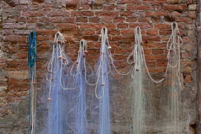 Low angle view of icicles hanging on wall