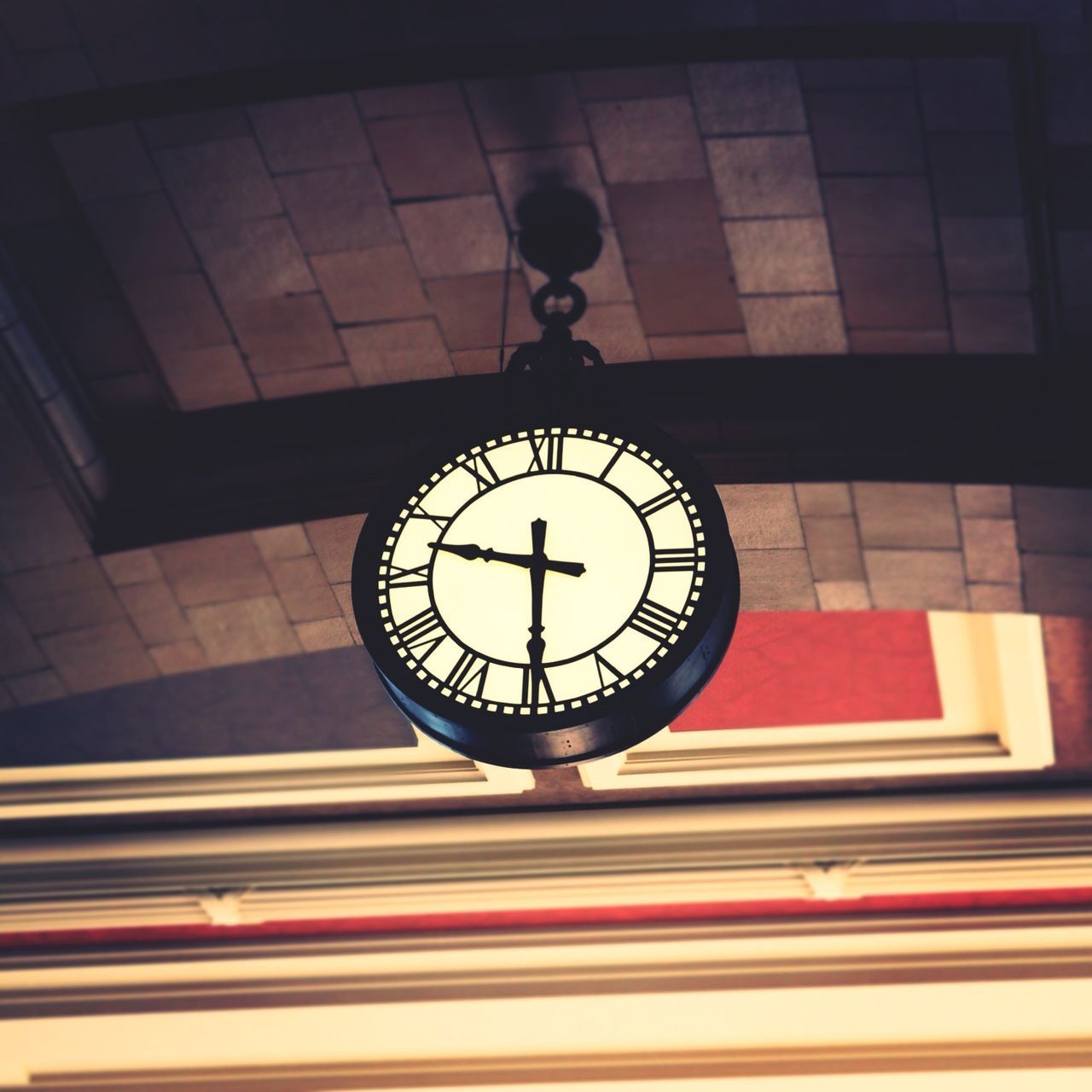 clock, time, indoors, low angle view, architecture, built structure, circle, clock face, ceiling, roman numeral, directly below, hanging, geometric shape, number, clock tower, minute hand, religion, no people, wall - building feature, lighting equipment