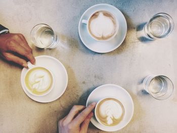 Coffee cup with coffee cup on table