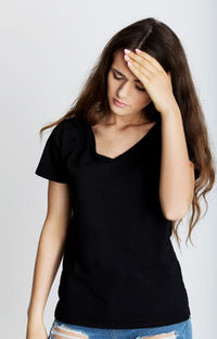 Portrait of a beautiful young woman over white background