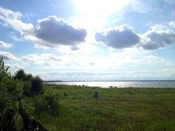 Scenic view of landscape against cloudy sky