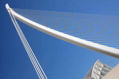 Low angle view of vapor trail against clear blue sky