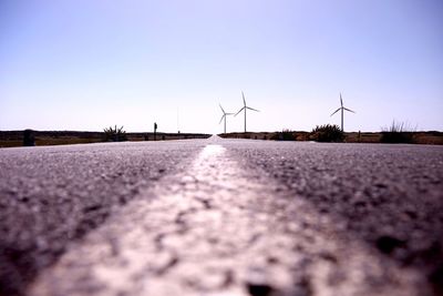 Surface level of wind turbines against clear sky