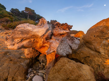 Rock formation on land against sky