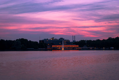 Scenic view of river against romantic sky at sunset