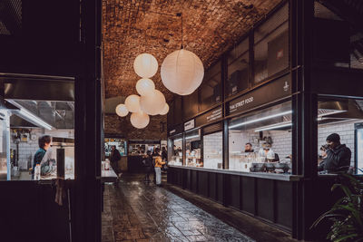 People in illuminated restaurant