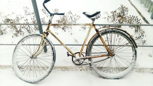 Close-up of bicycle wheel during winter