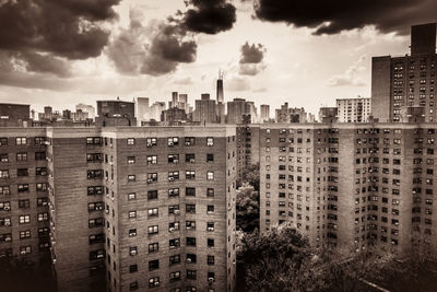 Buildings in city against sky