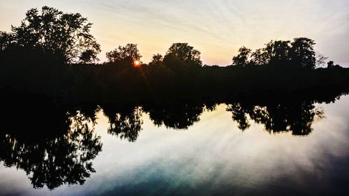 Scenic view of lake at sunset