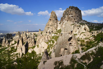 Panoramic view of rock formations against sky