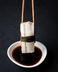 Close-up of sushi with soy sauce on table