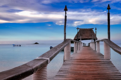 Pier over sea against sky