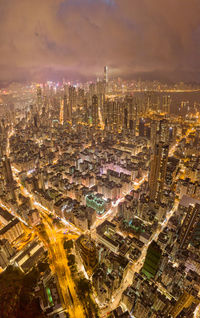 High angle view of city lit up at night