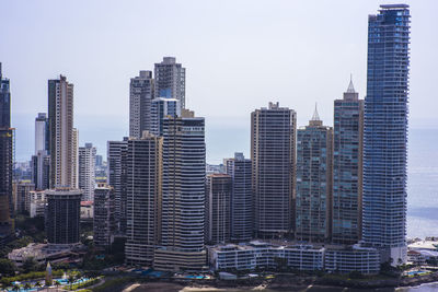 Skyscrapers in city against sky