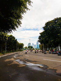 Vehicles on road along buildings