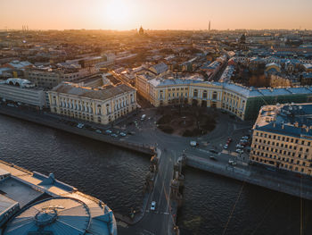 Aerial sunset cityscape of fontanka river in saint petersburg, russia. lomonosov bridge across river