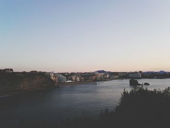 View of bridge over river against clear sky