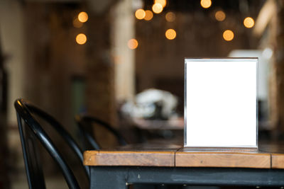 Close-up of illuminated lighting equipment on table