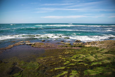 Scenic view of sea against blue sky