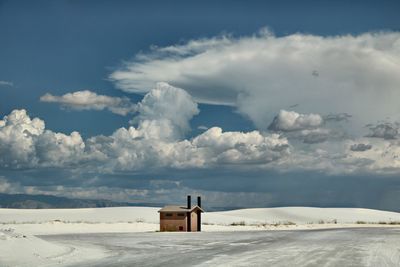 Scenic view of snow covered landscape against sky