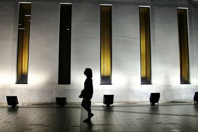 Woman standing in front of building