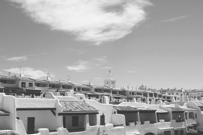 High angle view of buildings in town against sky