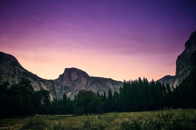 Scenic view of mountains against sky at sunset