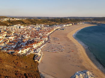 High angle view of beach and buildings against sky
