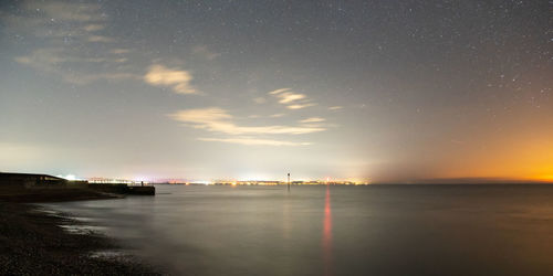 Scenic view of sea against sky at night