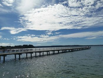 Pier over sea against sky