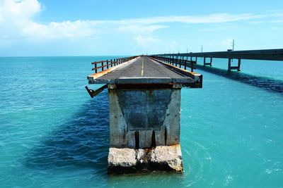 Gazebo in sea against sky