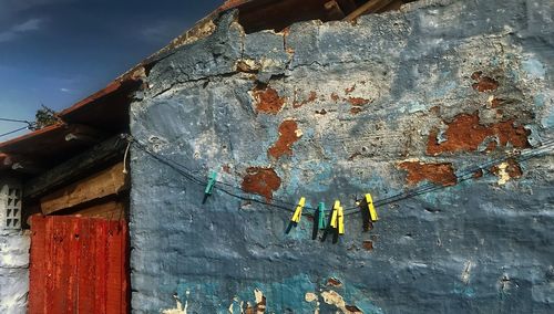 Low angle view of old weathered building