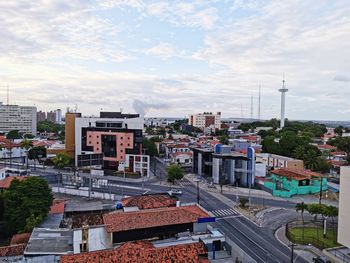 High angle view of buildings in city against sky