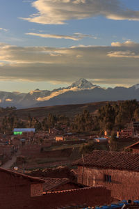 Aerial view of townscape against sky during sunset