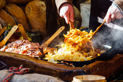 Midsection of man preparing food